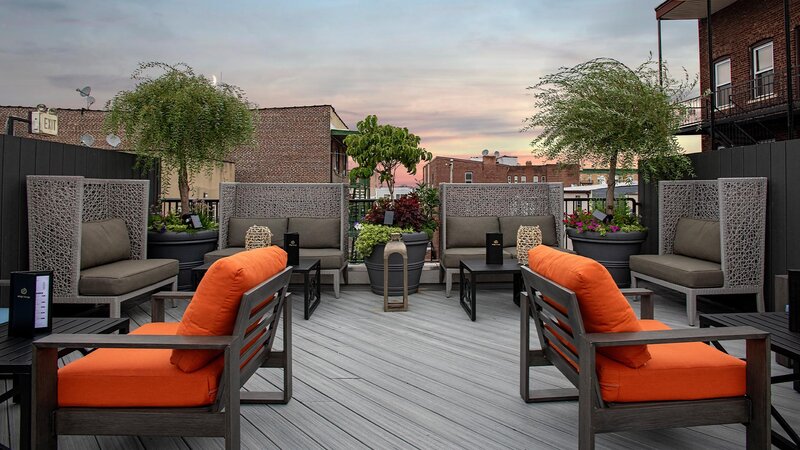 Couches and chairs on rooftop